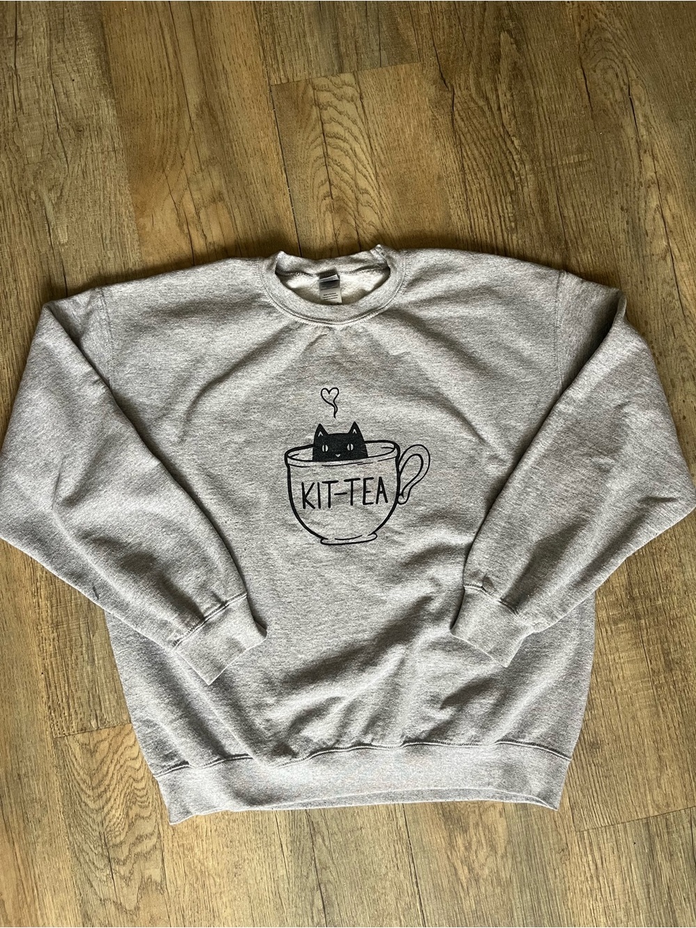 Light Gray Crewneck Sweatshirt with Black 'KIT-TEA' Cat Cup Graphic